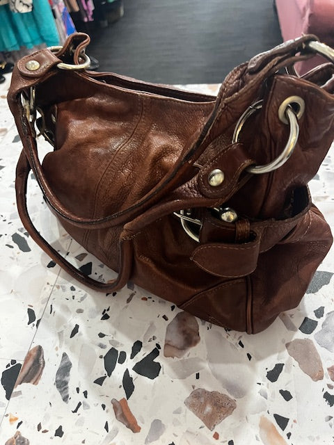 rustic deep tan leather handbag