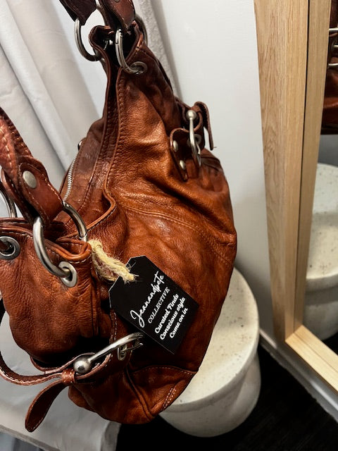 rustic deep tan leather handbag