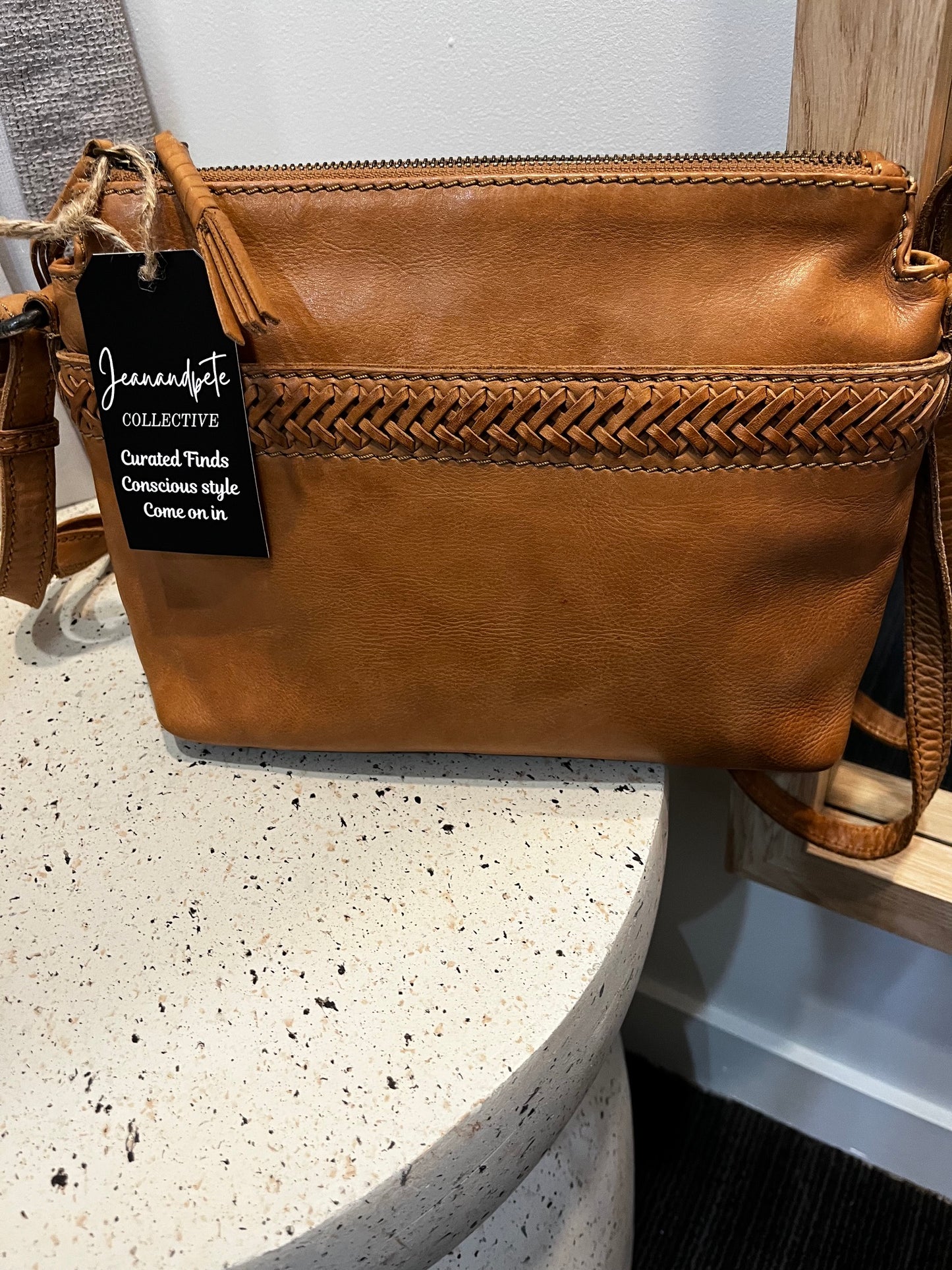 Evity leather side hung bag tan