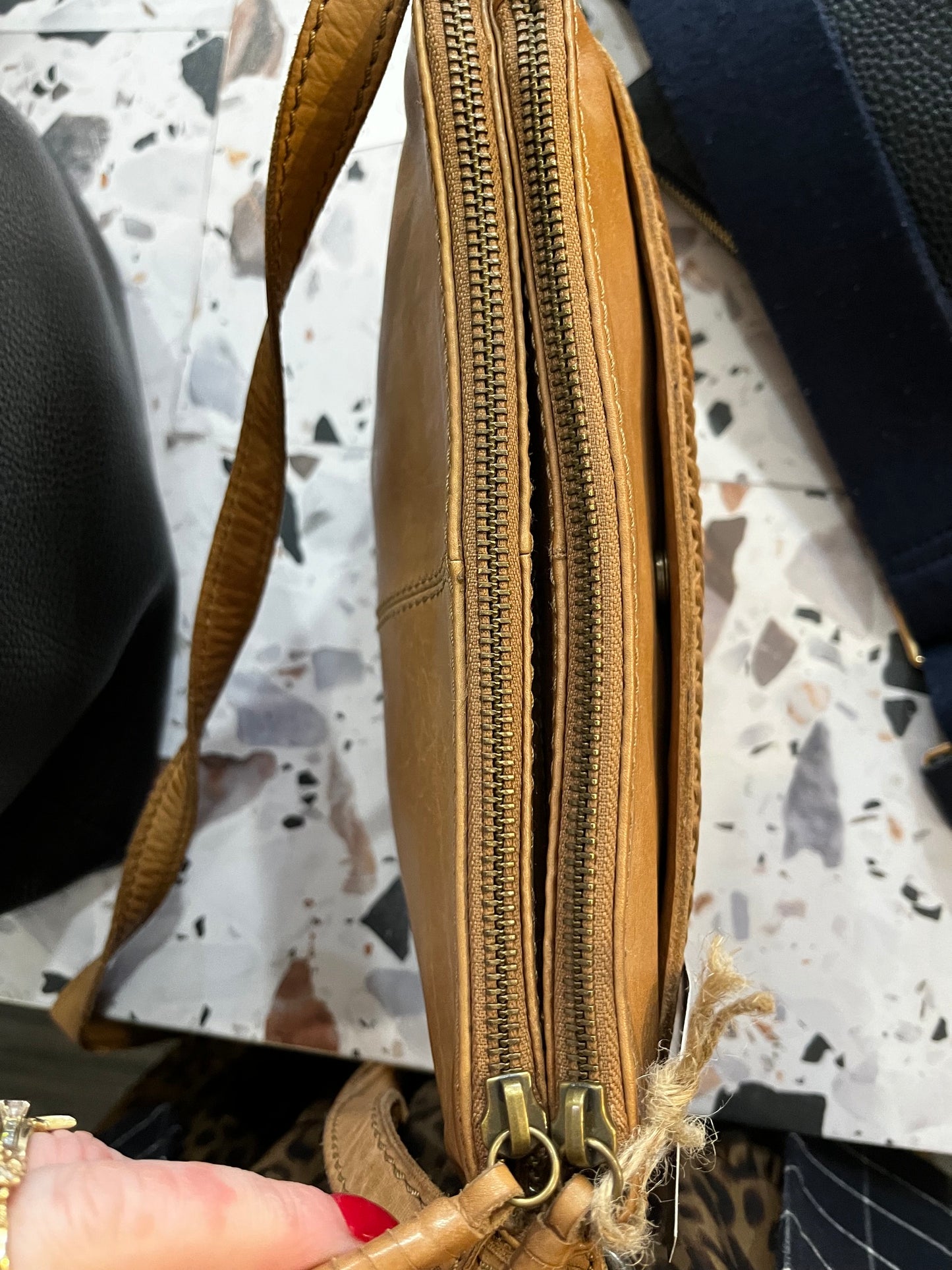 Evity leather side hung bag tan