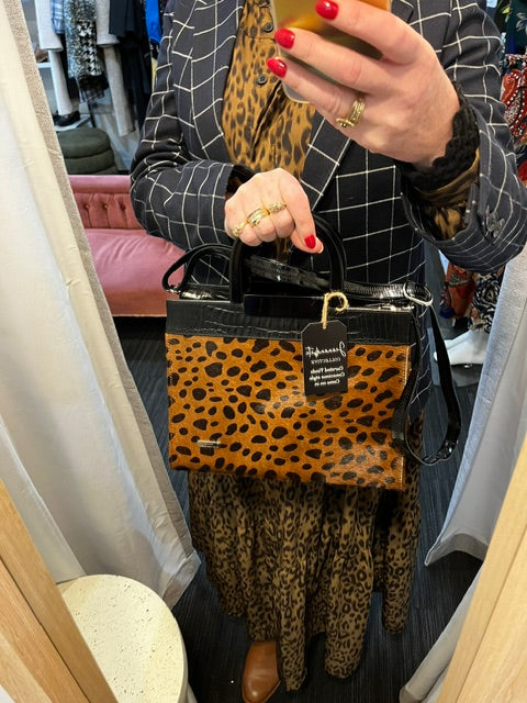 seranade cow hide print bag